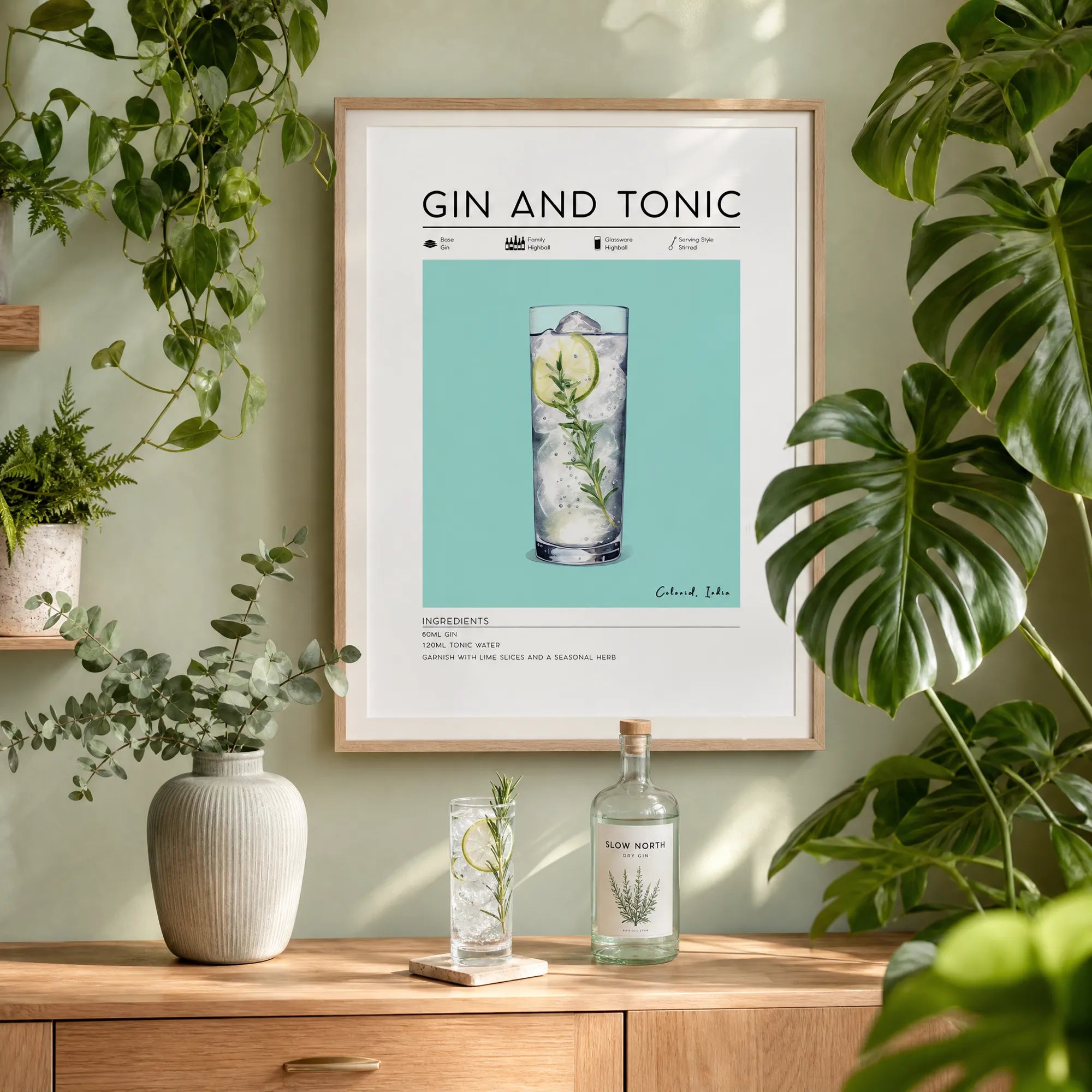 Gin and Tonic poster framed on wall surrounded by house plants. Home bar art