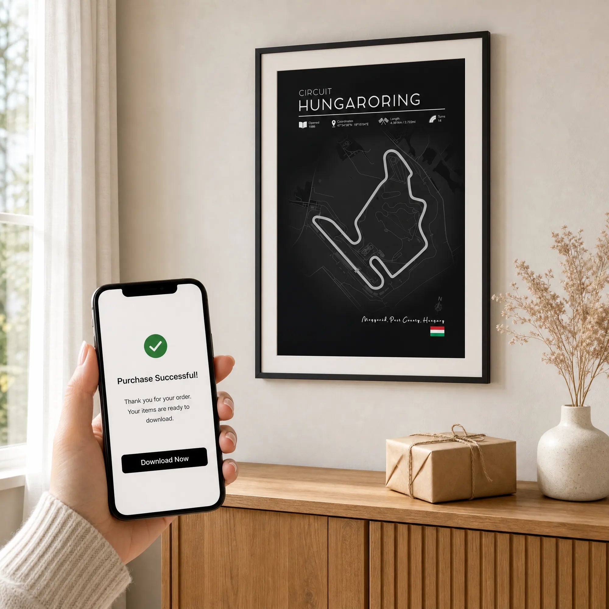 F1 gifts for him Hungaroring black edition circuit poster dark frame on white wall with kraft gift box and phone
