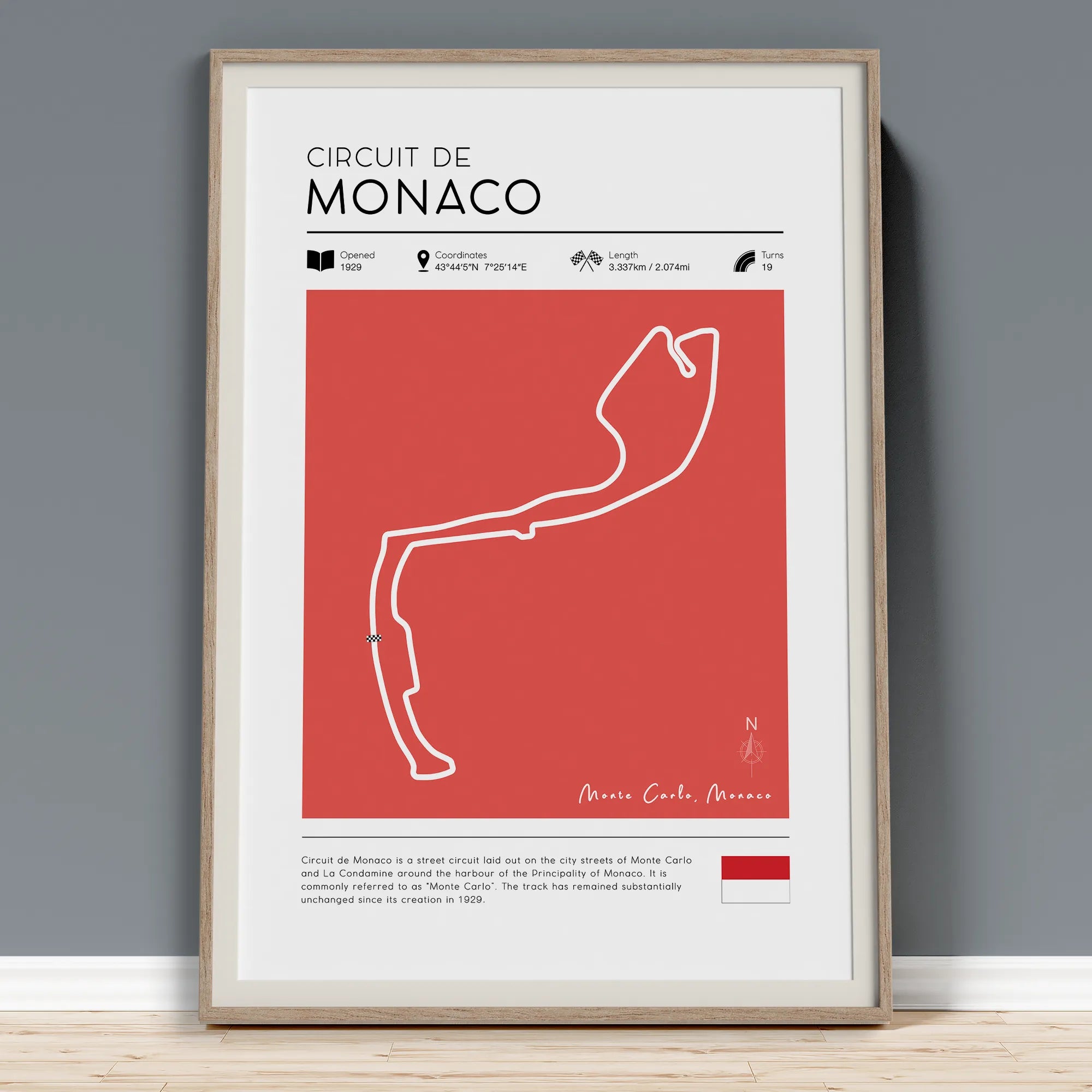 Circuit de Monaco f1 track poster in frame. Poster shows historical information, country flag and text about the famous race track